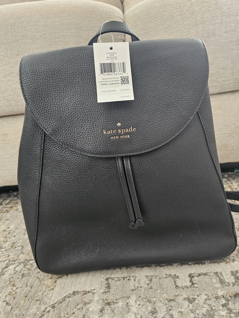 kate spade Black Pebbled Leather Backpack with Gold Logo